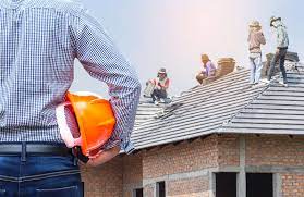 roofing contractor or a construction site where workers are installing roof tiles